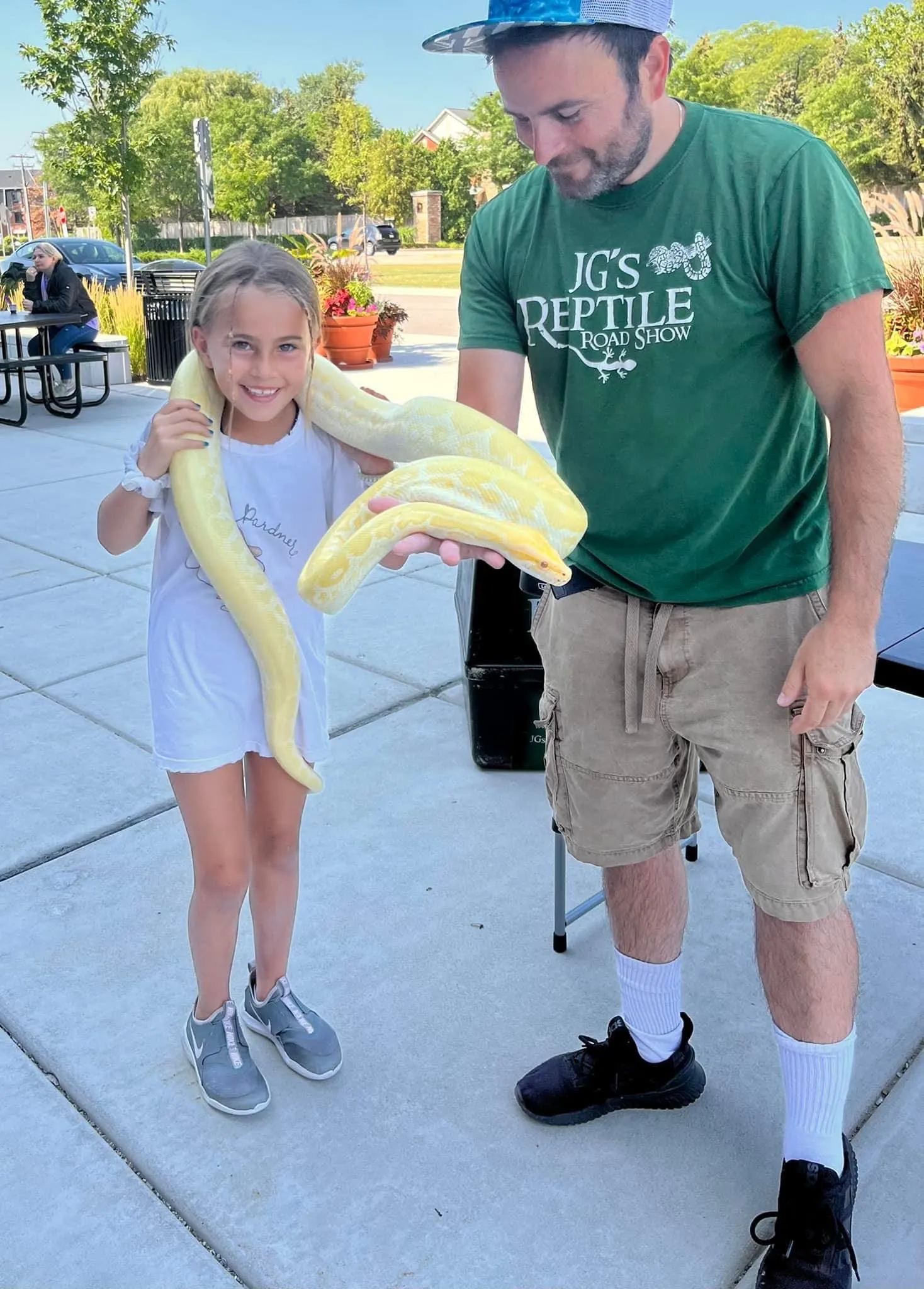 An outdoor summer event featuring the reptile road show